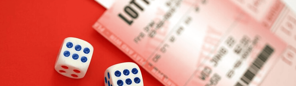 Lottery ticket and dice on a red background